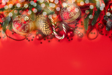 Christmas decorations on red background, top view