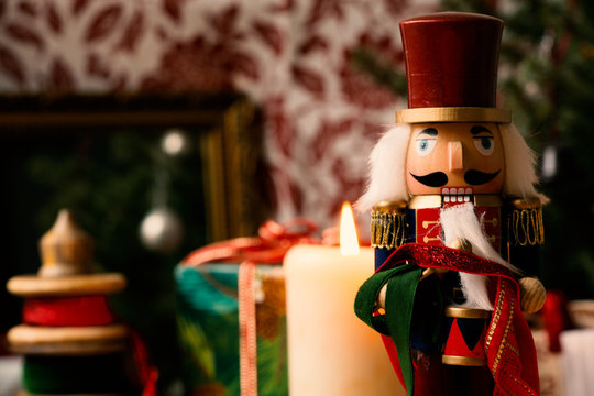 Nutcracker and christmas decoration in background