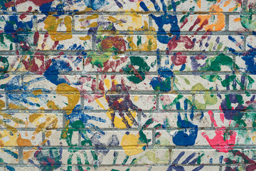 Fototapeta na wymiar Wall with handprints on a playground.