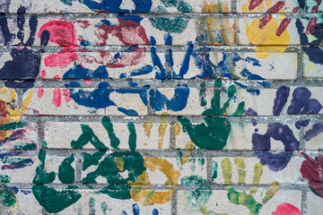 Wall with handprints on a playground.