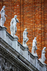detail of the statues above the ducal palace in piazza san marco in Venice, italy