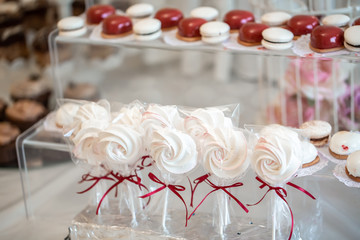 Candy bar. Candies table on the celebration party. Dessert table for a party. Table with sweets, candies, dessert, luxury wedding catering