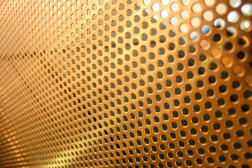 close detail of mesh panel with round holes in gilded bronze - 305540656