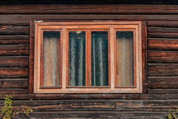 Russian village rustic wooden deck wall exterior of poor house window frame background 