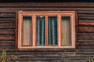 Fototapeta premium Russian village rustic wooden deck wall exterior of poor house window frame background 