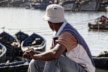 Essaouira, Morocco »; Spring 2017: A fisherman looking at the sea on the coast of Essaouira