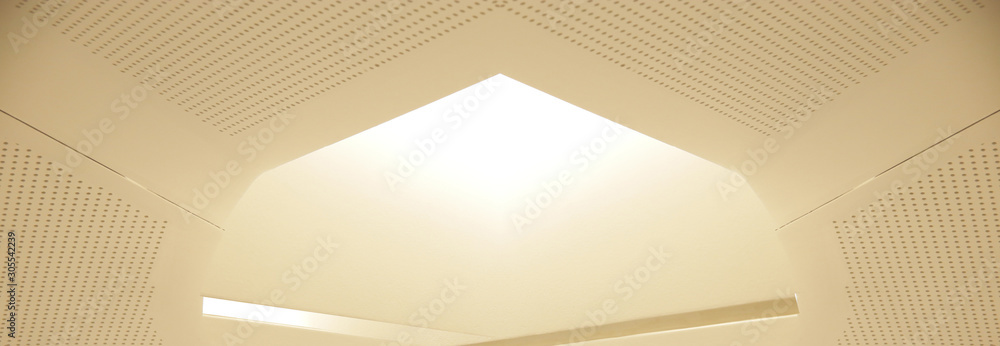 Poster perforated ceiling panels. reworked fragment of modern office architecture interior. angular geometr