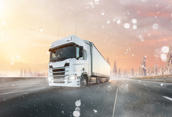 Truck with container on winter road, cargo transportation concept.