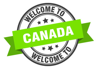Canada stamp. welcome to Canada green sign