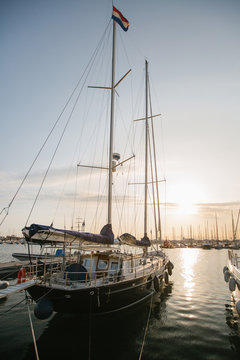 Exquisite yachts moored in calm water in bright day in Port Valencia, Spain