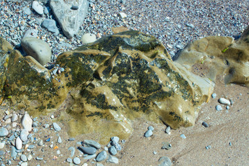A series of photographs - ancient stone formations. The colorful rocky stretch between а sand and а shore. Byala resort , Bulgaria.