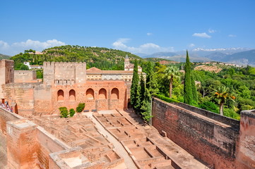 Fototapeta na wymiar Alhambra palace and gardens with Sierra Nevada mountains at background, Granada, Spain