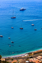 panorama of the coast with sea full of yachts in Taormina in Sicily, Italy