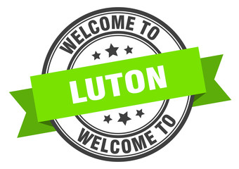 Luton stamp. welcome to Luton green sign