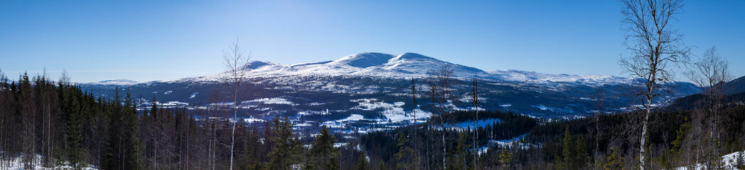 Mountains in Norway in Europe. High-quality panoramic photo. A sunny winter day