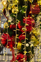 Naklejka premium New Year decorations. Flashlights, colorful balls, tinsel, spruce branches. New years eve