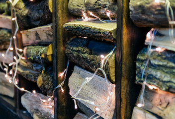 Wooden chocks laid horizontally between the boards and decorated with a luminous garland