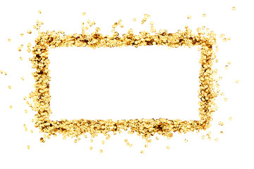 Gold holiday composition. Frame made of golden decorations confetti on white background. Christmas,...
