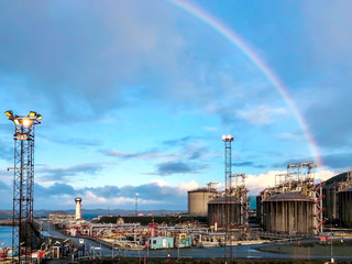 Beautiful rainbow over gas terminal. 