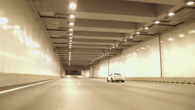 New stylish expressway Western Speed Diameter in St. Petersburg at night, highway tunnel through which car go fast