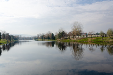 Autumn landscape with reflection of trees in water