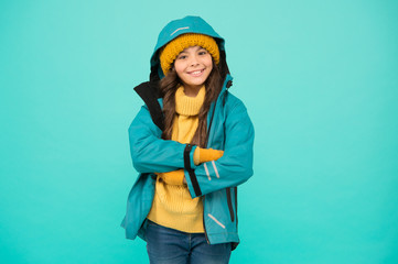 Best holiday. happy girl anorak jacket. Winter holidays. knitted clothes fashion. cold season weather. outdoor activity for kids. small girl sweater. hat and gloves accessory. warm clothes sales