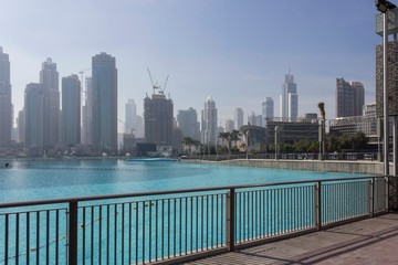 DUBAI, UAE - DECEMBER 26 2017: day view of Burj Khalifa lake with Dubai skyscrapers in the background
