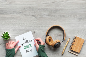 Concept zero waste conscious consumption flat lay, Top view of writing hands and paper. Text 