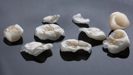 dental set over thin ceramic tabs on a light background