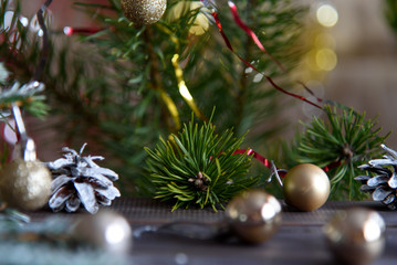 Christmas, decoration on a wooden table. Christmas pine cones and golden Christmas balls.