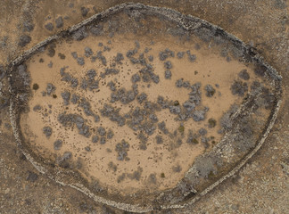 Ancient civilisation walled property in the desert, top down aerial background view