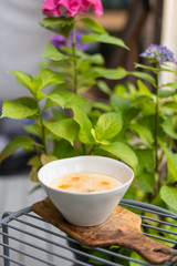 Creamy Rice Pudding with Apricot Jam and Almond Crumb. Breakfast in Garden