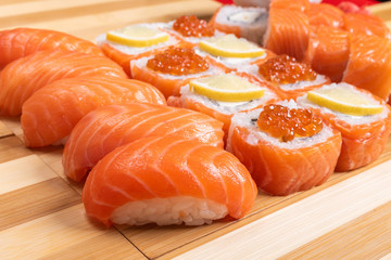 Sushi set with salmon. Philadelphia., with caviar. With ginger and wasabi. Close-up.