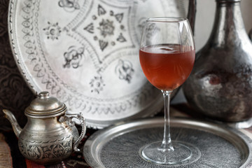 Iced Rosehip Drink. Light Metal Background.
