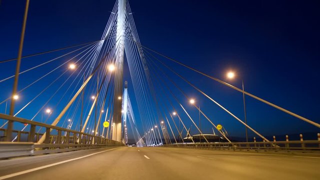 New stylish expressway Western Speed Diameter in St. Petersburg at night, the Big Cable-stayed Bridge impresses with its size and beauty