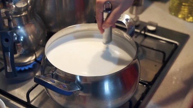 cook is mixing yogurt soup, 120fps slow motion shot,