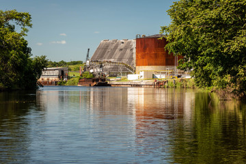 Modern Sugar Cane factory on New River in Orange Walk County, Belize, Central America.