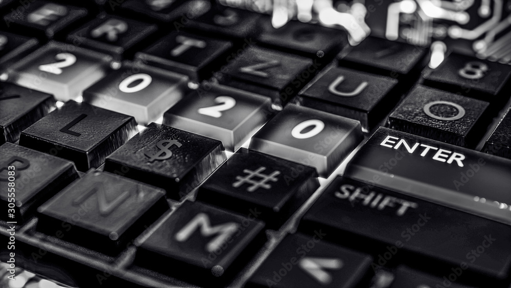 Poster close up view of keyboard with red light on 2020 number keys and enter key. technical concept for en