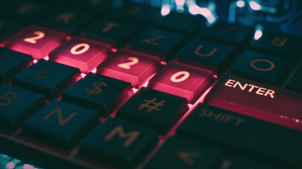 Close up view of keyboard with red light on 2020 number keys and enter key. Technical concept for entrance or start to new year. Happy new year, 2020. 3D rendering.