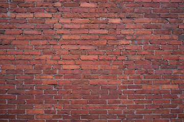 Old red brick wall. Grunge red vintage background.