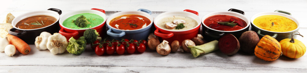 Variety of colorful vegetables cream soups and ingredients for soup. Concept of healthy eating or vegetarian food with mushrooms
