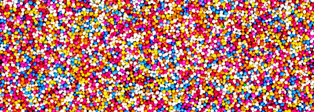 Fun, multicolor abstract of cake toppings, 100's and 1000's - candy banner / panorama / header for sweet design - food concept.