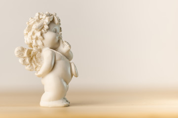 plaster figurine of a little angel with a place for inscription