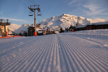 Freshly groomed lines in the snow, in focus, in the skiing resort of Avoriaz in the Portes du Soleil ski region in the Alps in France