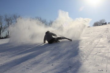 Skier falling on the trail