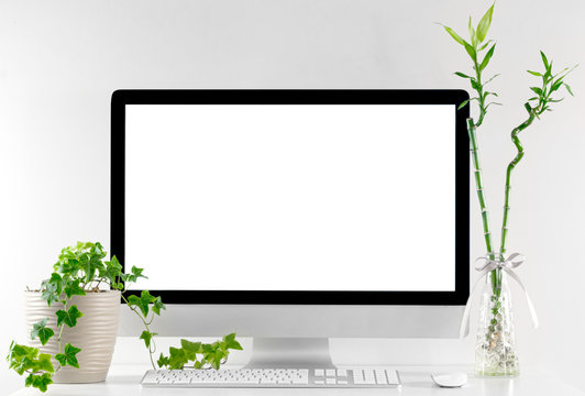 Computer all in one in office table with isolated white screen