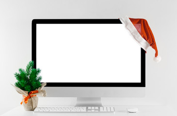 Computer all in one with isolated white screen in Christmas time.