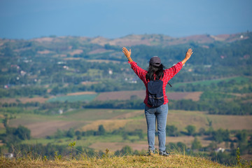 Retired woman Happy to travel on high hills.