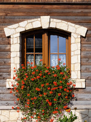 Fototapeta na wymiar Window of a rural wooden house.