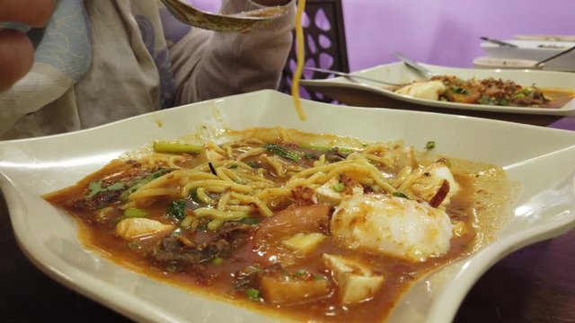 Mee Bandung Muar: Special dish noodle originated from Muar District, Johore, Malaysia. The Noodle is prepared with special paste with fresh prawn and vegetables, selective focus